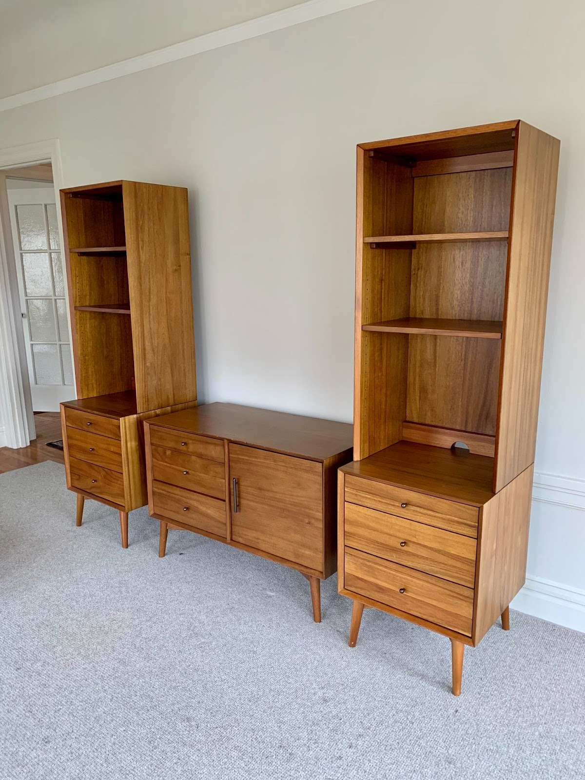 Claire McCann, 27, Lugg delivered this mid-century modern West Elm media center up three flights of stairs and back down when someone bought it. I purchased it for $650 and sold it for $1700.