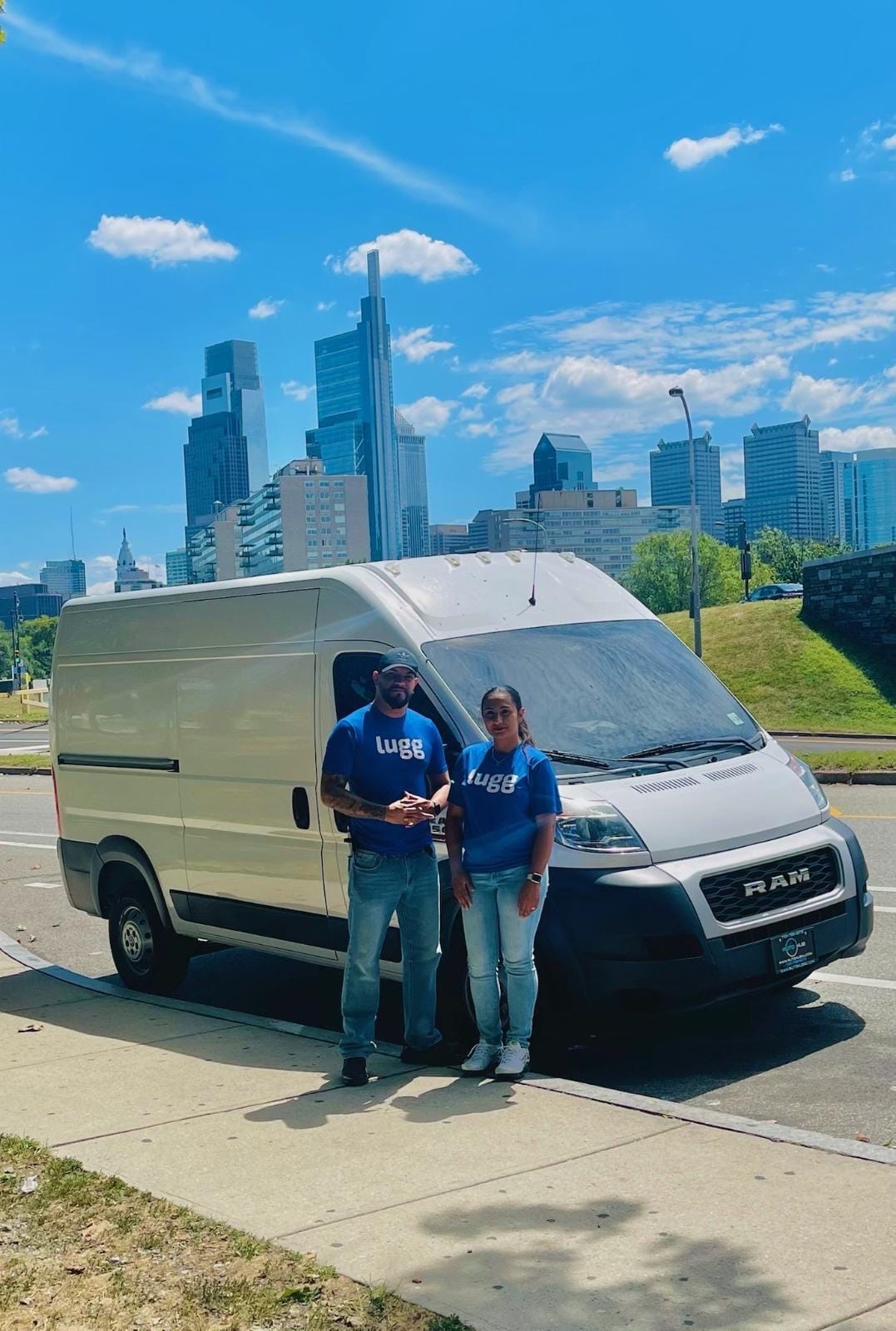 Two Luggers in Philadelphia pose for a photo outside their moving van with the skyline in the background in celebration of Lugg's 3 year anniversary. 
