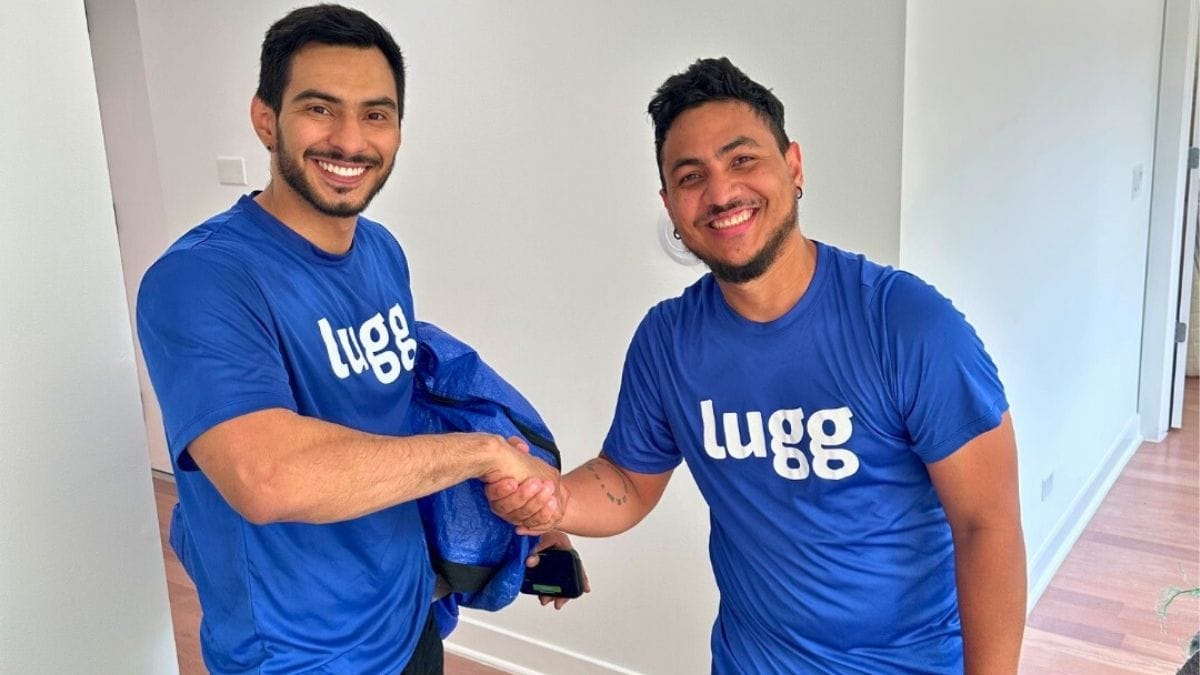 Two Lugg movers celebrating after completing a furniture delivery